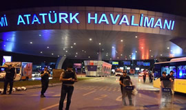 Policemen stand guard at the entrance to Ataturk International Airport in Istanbul, Turkey, after the bomb attacks that killed 36 people on Tuesday night. Xinhua