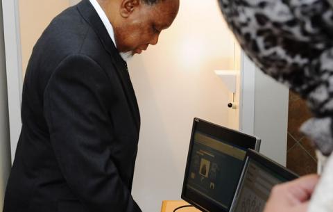 Deputy President Kgalema Motlanthe applies for a Smart Identity Card at Byron House in Pretoria ahead of the official launch on Nelson Mandela Day. Source: GCIS