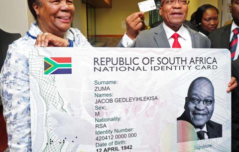 President Jacob Zuma receives his Smart ID Card from Minister of Home Affairs Naledi Pandor at Byron House in Pretoria. Source: GCIS