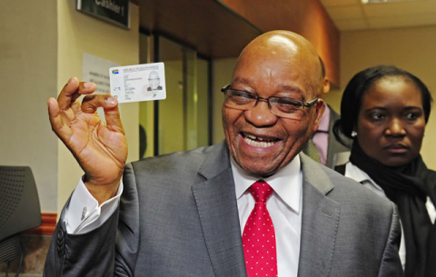 President Jacob Zuma receives his Smart ID Card from Minister of Home Affairs Naledi Pandor at Byron House in Pretoria. Source: GCIS