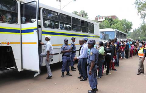 Members of the public board a bus to go to the Union Buildings to view Mandela's remains, who is lying in state at the Union Buildings. Source: GCIS