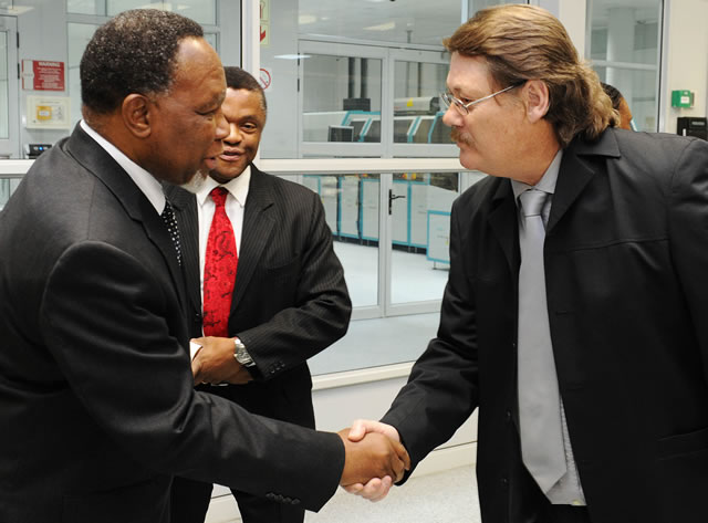 Minister of Home Affairs Naledi Pandor, Deputy President Kgalema Motlanthe and Chief executive Officer of GPW Prof. Anthony Mbewu inspecting equipment to be used for producing Smart Identity Cards at Government Printing Works in Pretoria ahead of the official launch on Nelson Mandela Day. Source: GCIS