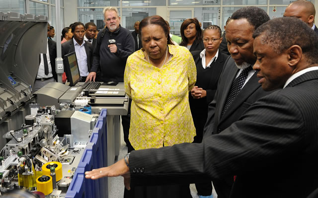 Minister of Home Affairs Naledi Pandor, Deputy President Kgalema Motlanthe and Chief executive Officer of GPW Prof. Anthony Mbewu inspecting equipment to be used for producing Smart Identity Cards at Government Printing Works in Pretoria ahead of the official launch on Nelson Mandela Day. Source: GCIS