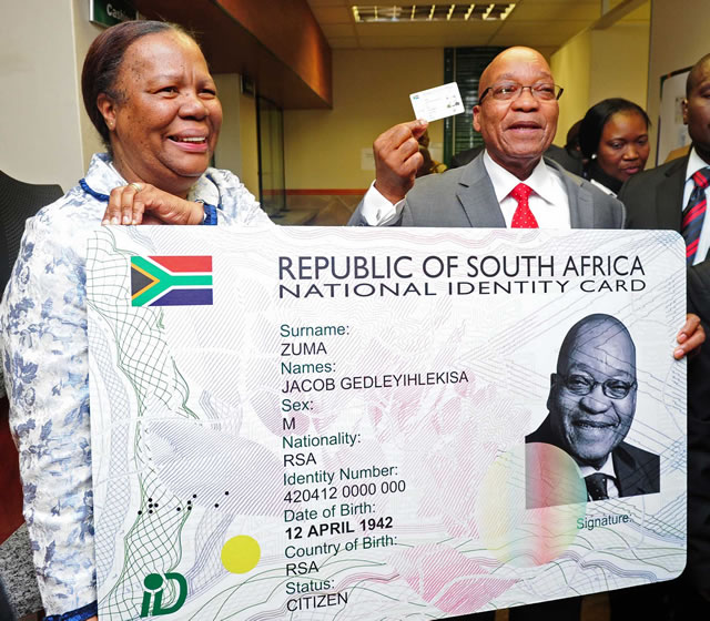 President Jacob Zuma receives his Smart ID Card from Minister of Home Affairs Naledi Pandor at Byron House in Pretoria. Source: GCIS