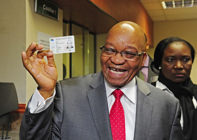 President Jacob Zuma receives his Smart ID Card from Minister of Home Affairs Naledi Pandor at Byron House in Pretoria. Source: GCIS