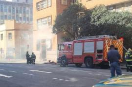 The Fire Department attends to the fire at the SARS Rissik Street branch.