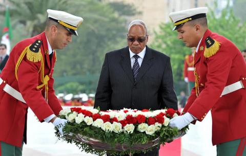 President Zuma is assisted by the ceremonial guard as he lays wreaths at the Moujahidi Matyr Monument in honour of Algerian national heroes. Source: GCIS