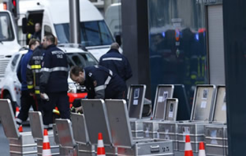 Investigators and security personnel work outside the Maalbeek metro station in Brussels, capital of Belgium, on 22 March 2016. Source: Xinhua/Ye Pingfan