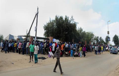 Hundreds of people queue to cast their vote on May 7. Source: GCIS