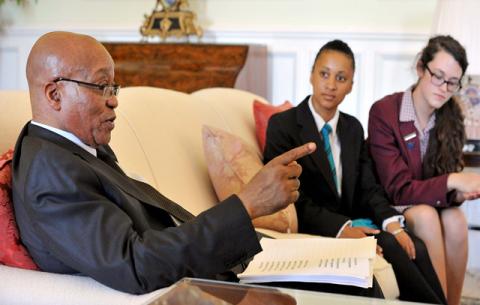 President Jacob Zuma hosted Matriculants Merissa Schikker - Ceddar High School (Blue jacket) and Maxine Gibb - Westford High School (Red Jacket) gathering their ideas ahead of the State of the Nation Address at his official residence in Genadendal, Cape Town. Source: GCIS.