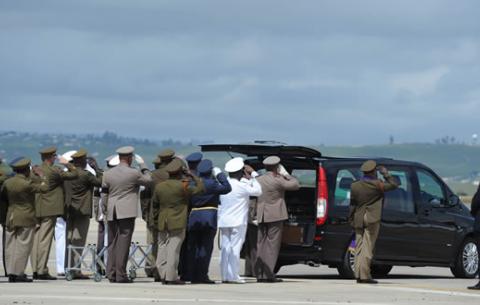 The SANDF pallbearers put Madiba's casket into the hearse before heading off to Qunu. Source: GCIS