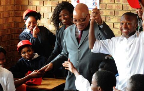 President Jacob Zuma and Kagiso Hlagala during a walkabout in ISHP Mobiles; Health Screening and Health Education Observation at Chipa Tabane Secondary  School in Refilwe, Cullinan. Source: GCIS