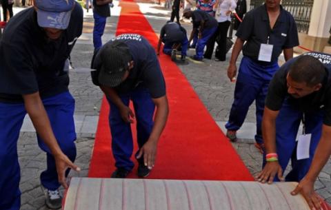 Workers roll out the red carpet for the State of the Nation Address. Source: GCIS