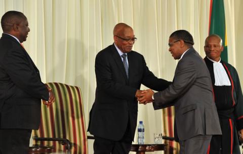 Deputy President Cyril Ramaphosa and President Jacob Zuma congratulate Minister of Sport and Recreation Fikile Mbalula after he is sworn into office. Source: GCIS