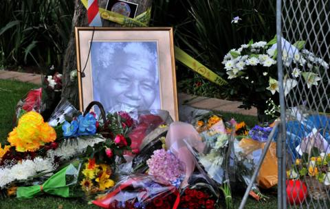 Flowers laid outside Madiba's house in Houghton. Source: GCIS