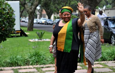 Defence Minister Nosiviwe Mapisa Nqakula waving to the crowd outside the Mandela household in Houghton. Source: GCIS