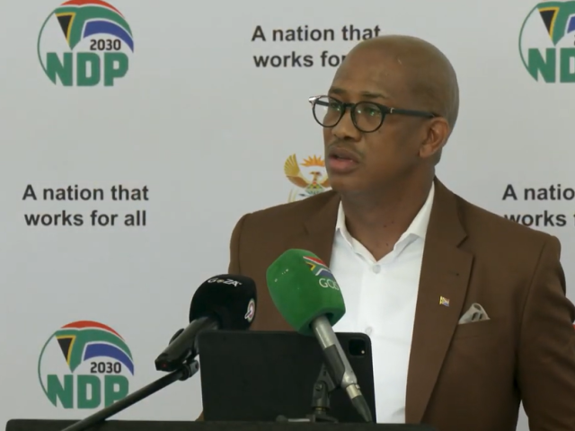 Deputy Minister Kenny Morolong donates school shoes in the North West province.