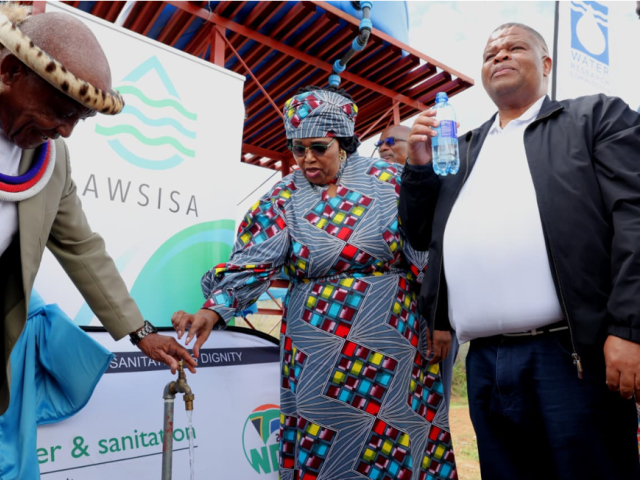 Water and Sanitation Minister Pemmy Majodina hands over a borehole at Sokhulumi in Bronkhorstspruit.