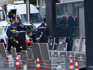 Investigators and security personnel work outside the Maalbeek metro station in Brussels, capital of Belgium, on 22 March 2016. Source: Xinhua/Ye Pingfan
