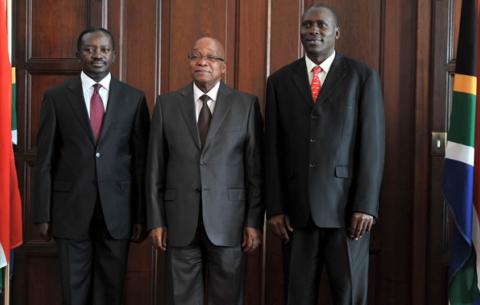 President Zuma receives letters of credence from the High Commissioner of Uganda, Julius Moto and Mission Official Kajwengye Twinomugisha (left). Source: GCIS