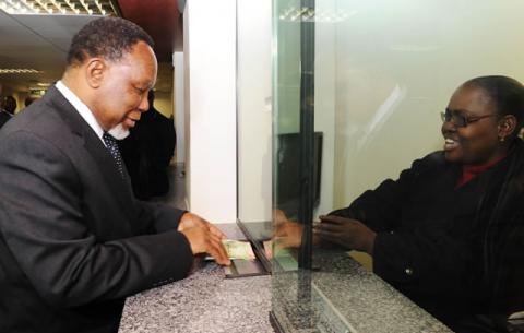 Deputy President Kgalema Motlanthe applies for a Smart Identity Card at Byron House in Pretoria ahead of the official launch on Nelson Mandela Day. Source: GCIS
