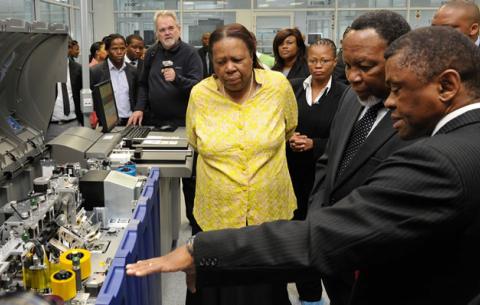 Minister of Home Affairs Naledi Pandor, Deputy President Kgalema Motlanthe and Chief executive Officer of GPW Prof. Anthony Mbewu inspecting equipment to be used for producing Smart Identity Cards at Government Printing Works in Pretoria ahead of the official launch on Nelson Mandela Day. Source: GCIS