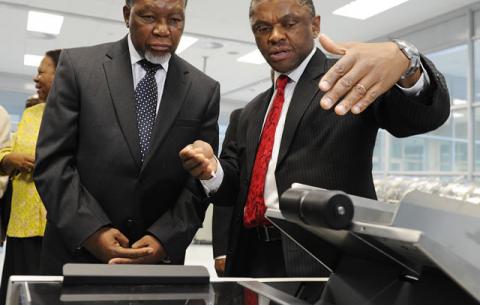 Minister of Home Affairs Naledi Pandor, Deputy President Kgalema Motlanthe and Chief executive Officer of GPW Prof. Anthony Mbewu inspecting equipment to be used for producing Smart Identity Cards at Government Printing Works in Pretoria ahead of the official launch on Nelson Mandela Day. Source: GCIS