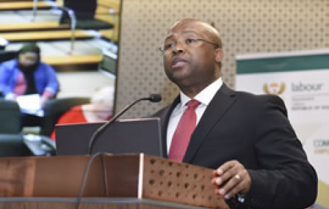 Acting Chairperson and Director-General of Labour, Thobile Lamati, hands over the 15th CEE Annual Report and 2014 Public register during the launch of the 2014 Employment Equity Report, Pretoria. GCIS
