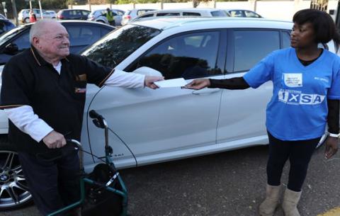 An elderly man is assisted by an electoral worker on May 7. Source: GCIS
