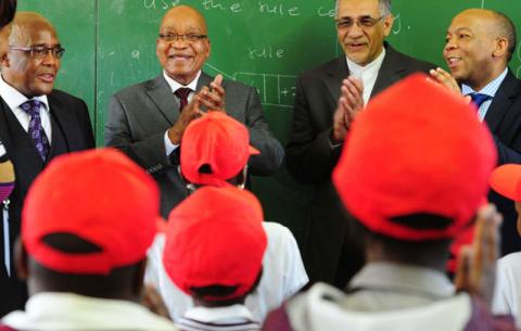 Minister of Health Dr Aaron Motsoaledi; President Jacob Zuma; Deputy Minister of Basic Education Enver Surty and Tshwane Municipality Executive Mayor Kgosientso Ramakgopa during a walkabout in ISHP Mobiles; Health Screening and Health Education Observation at Chokoe Primary School in Refilwe, Cullinan. Source: GCIS