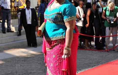 Faith Bikani poses for photographers on arrival at Parliament. Source: GCIS