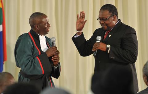 Police Minister Nkosinathi Nhleko being sworn in by Deputy Chief Justice Dikgang Moseneke. Source: GCIS