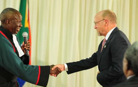 Minister of Tourism Derek Hanekom being sworn in by Deputy Chief Justice Dikgang Moseneke. Source: GCIS