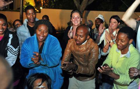 Mourners holding a night vigil in song and dance outside the late former President Nelson Mandela's Home in Houghton. Source: GCIS