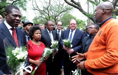 Mandla Mandela receiving Sports Minister Fikile Mbalula, Arts Minister Paul Mashatile and Deputy Minister Gert Oosthysen accompanied at Mandela's house in Houghton. Source: GCIS