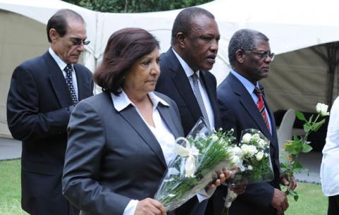 Orlando Pirates chairman Ivan Khoza and Thandile Babalwa Sunduza laying flowers outside Nelson Mandela's house in Houghton. Source: GCIS