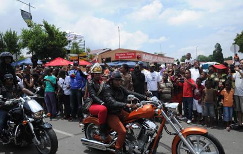 Bikers joined the mourners on Vilakazi Street near Nelson Mandela's old house in Soweto. Source: GCIS