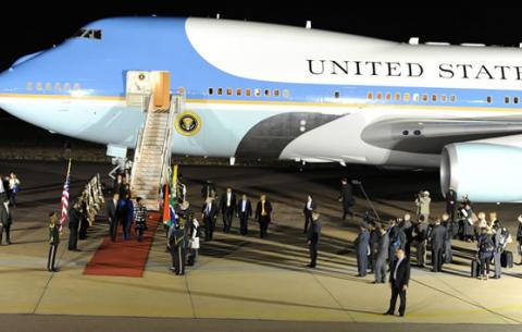 Minister Nkoana Mashabane welcoming US President Obama, his wife and daughters just after landing at Waterkloof Air Force Base. Source: GCIS