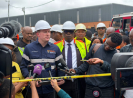 Minister Macpherson at the site of the collapsed building in Ormonde.