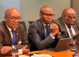 Minister Tau (left).