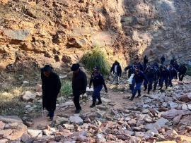 Minister Cele inspects an abandoned mine where illicit activities have been taking place.