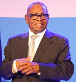 Minister Nzimande standing on stage.