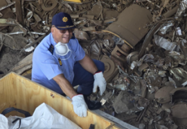 Officer destroying illegal firearms.