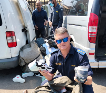 Officer seizes fake goods.